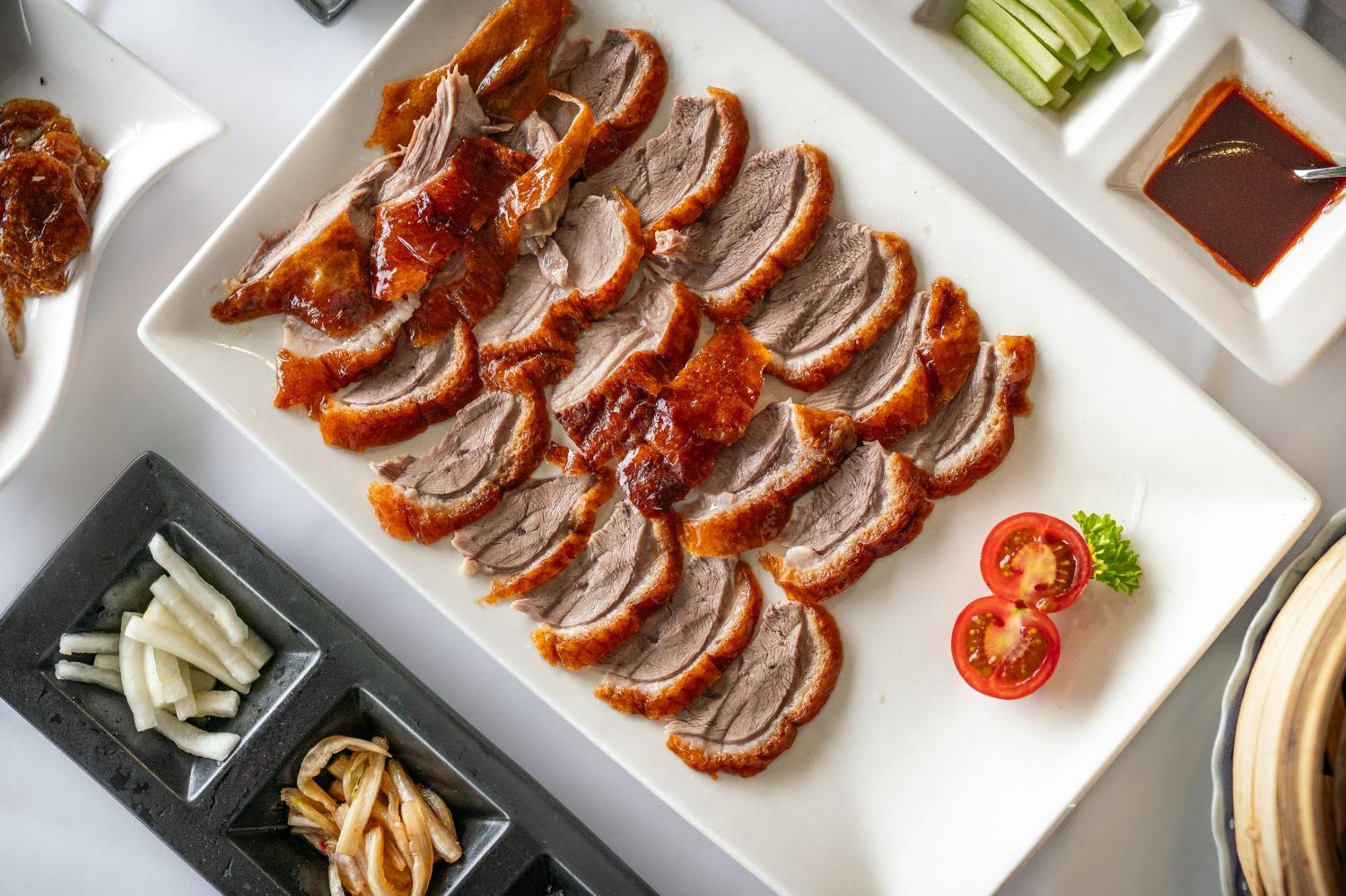 Royal Garden Hotel London Exterior photo Sliced roast duck